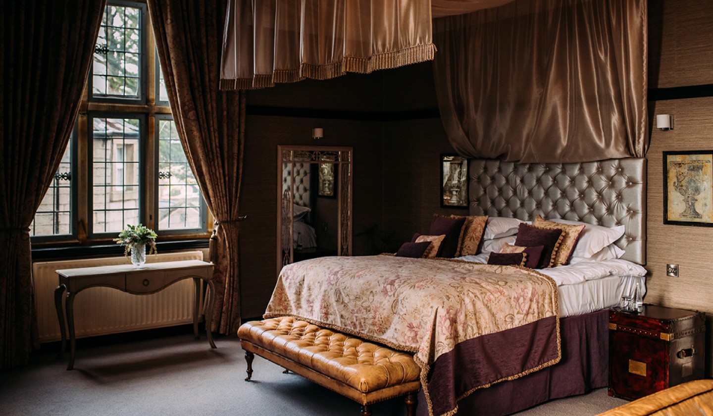 Double guest room with large satin bed canopy